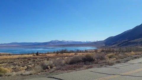 Pan view of a landscape and the mono lake, in autumn, at Mono lake, in Cali.. Stock Footage 72420595