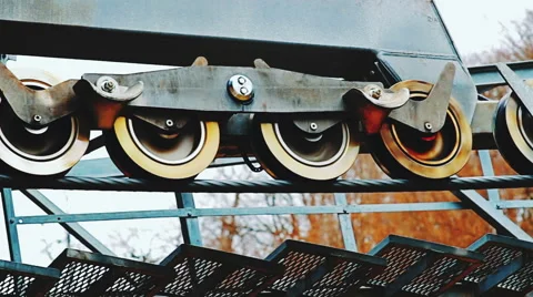 Pan view of mechanism with rotating rollers driving the cableway Stock Footage 61072886