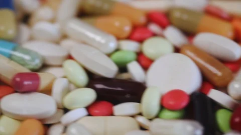 Pan view of medication drug stack with many pills Stock Footage 97053699