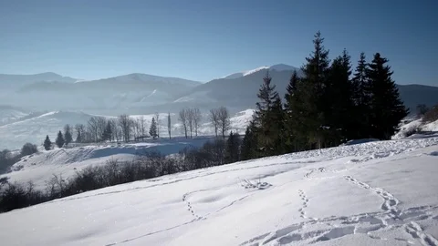 Pan View of Mountain Ridge and Snow Covered Mountains, Traditional Village and Stock Footage 72175791