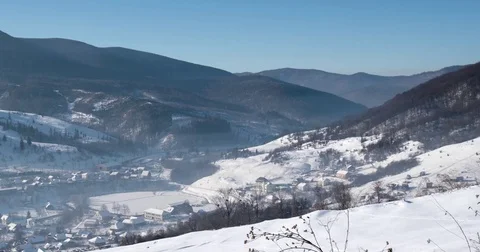 Pan View of Mountain Ridge and Snow Covered Mountains, Traditional Village and Stock Footage 72175864
