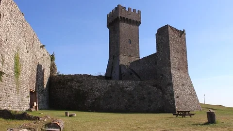 Pan view of an old medieval tower in the countryside of Tuscany, Italy. Stock Footage 97869597
