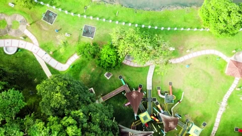 Pan up view of playground next to the cloudy lake in Bangi, Selangor, Malays Stock Footage 342390184