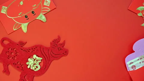 Pan view red pockets with Chinese currency for the year Ox Stock Footage 147428320