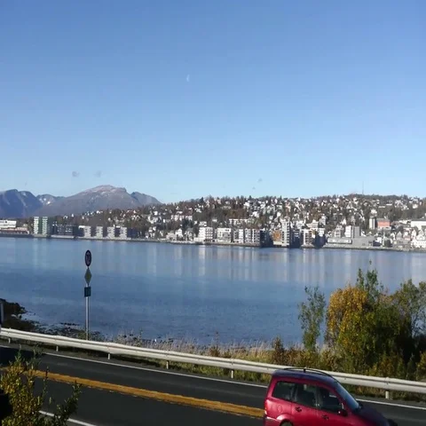 Pan view on a road in front of the city of Tromso, in north Norway Stock Footage 69427043