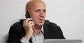 Pan View Serious Businessman Image Cellphone Talking Contract Financial Details 4k or 4k+ Resolution
