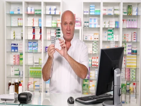 Pan View Serious Pharmacist Presentation Commercial Druggist Talk About Pills Stock Footage 83682232