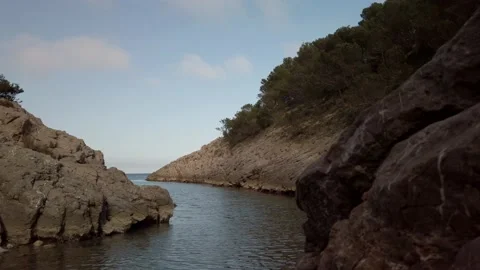 Pan view from small rocky bay Cala Pedrosa (Catalunya) Video stock 159980582