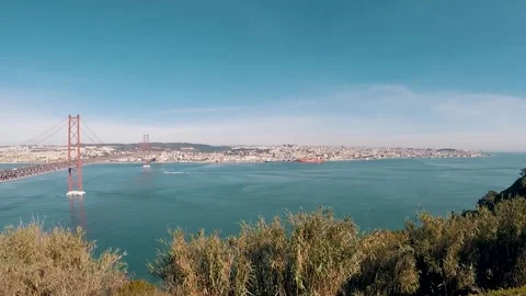 Pan view of surround area of april 25 bridge in Lisbon, Portugal Stock Footage 148699211