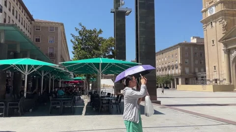 Pan view on Tourists in the main square Plaza del Pilar of  Zaragoza taking phot Stockbeeldmateriaal 249354740