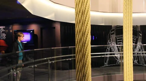A pan of a visitor checking out the taipei 101 wind dampener Stock Footage 36463548