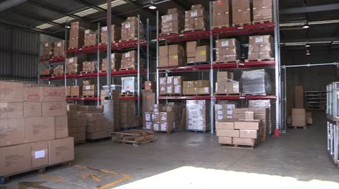 Pan of Warehouse filled with cardboard boxes Stock Footage