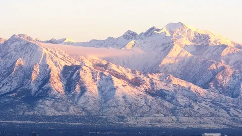 Pan of Wasatch Mountains, Utah in Winter at sunset. Stock Footage 99932995