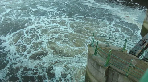Pan water flowing through Barrage to construction of White Water Course Stock Footage 1064961