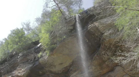 Pan of Waterfall From a Cliff Stock Footage 62514560