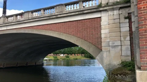 Pan Up from Waters edge to sky view along Hampton Court Bridge Vídeos de archivo 110889359