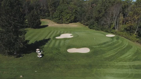 Pan Up While Golfers Exit Golf Carts Stock Footage 91898124