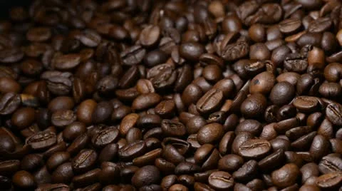 Pan on white candle on coffee beans Stock Footage 22105510