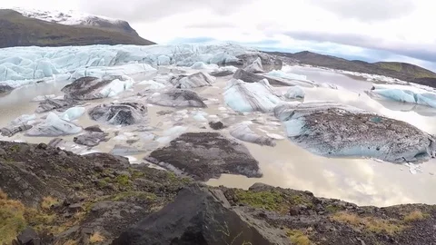 Pan up wide angle glacier lake ice Stock Footage 124146631