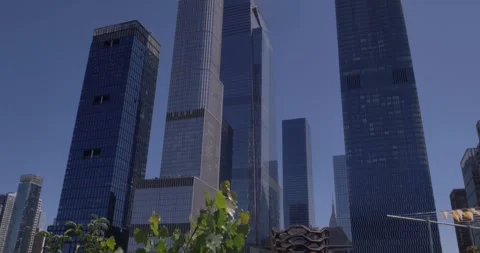Pan Up Wide Angle View of The Vessel Building with NYC Skyscrapers Behind It Stock Footage 246326807