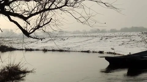 Pan to the windmill in the winter in Holland Stock Footage 153886931