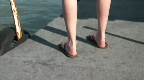 Pan up Woman's Body on Dock Video stock 12600618