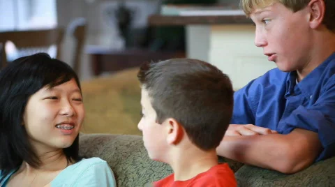 Pan young friends on the sofa Stock Footage
