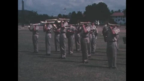 PANAMA - 1969: Flag procession - Color guard carries flags across the field Vidéo 344910997