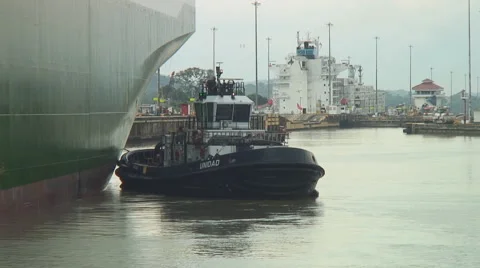 Panama Canal: Tugboat at work Stock Footage 1048356