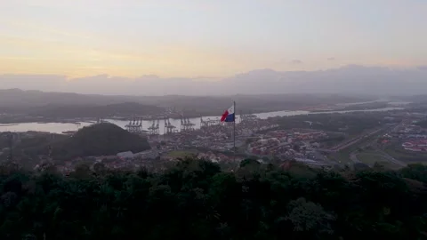 Panama Flag Flying Above Ancon Hill with Panama Canal Maritime Port Aerial View Видео 340034978
