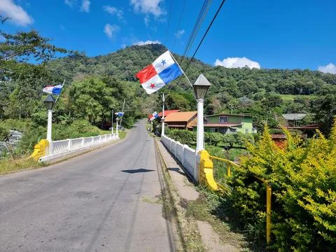 Panama, flags on the pillars of a bridg Stock Photos