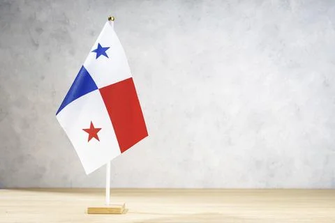 Panama table flag on white textured wall. Copy space for text, designs or 스톡 일러스트