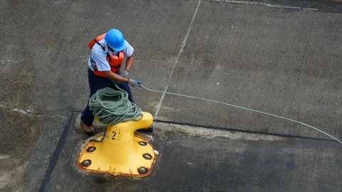 Panamanian man wearing safety equipment working  at the locks of Panama Canal. Stock Footage