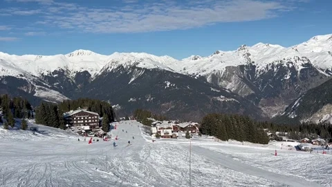 Panaromic view of Courchevel ski resort with slopes and chalets by winter Stock Footage 337135589