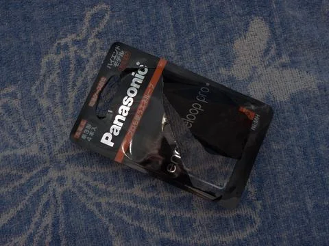 The Panasonic battery Opened packaging. Fotos de archivo