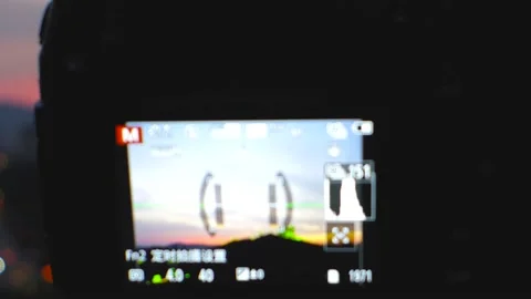 A Panasonic G9 camera mounted on a Manfrotto tripod for a time-lapse landscape v Stock Footage 160877253