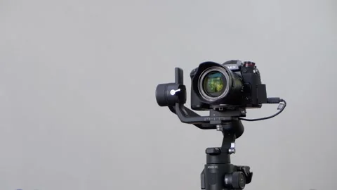 A Panasonic G9 mirrorless camera mounted on an electronic gimbal stabilizer Stock Footage 160877200