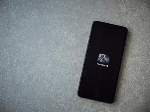 Panasonic Image App app launch screen with logo on the display of a black mob Stock Photos