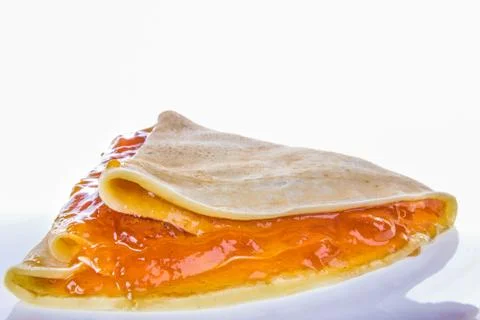 Pancake with apricot jam Stock Photos