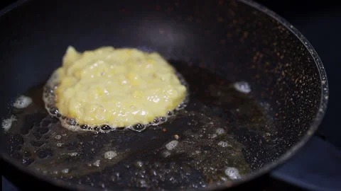 Pancake Batter / Mix Dropping From A Spoon Into A Frying Pan. Stock Footage 160116269