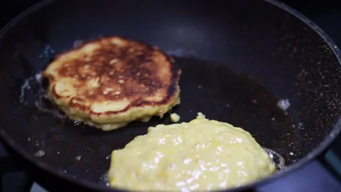 Pancake Batter / Mix Dropping From A Spoon Into A Frying Pan. Stock Footage 160116579