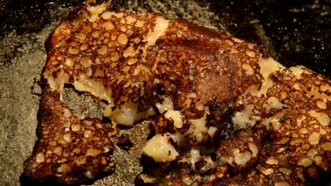 Pancake is being baked Stock Footage 256038386