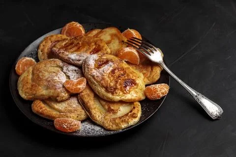 Pancake breakfast. Delicious stack mandarin, apple Stock Photos