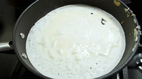 Pancake is fried in a pan. Stock Footage 231366833