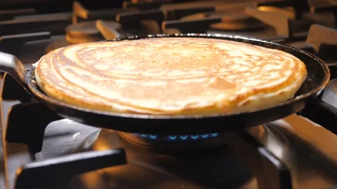 Pancake frying on a frying pan. Stock Footage 150431978