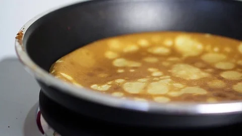 Pancake on frying pan Stock Footage 84603388