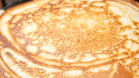 Pancake is frying on a pan. Thick pancake Video stock 247404979