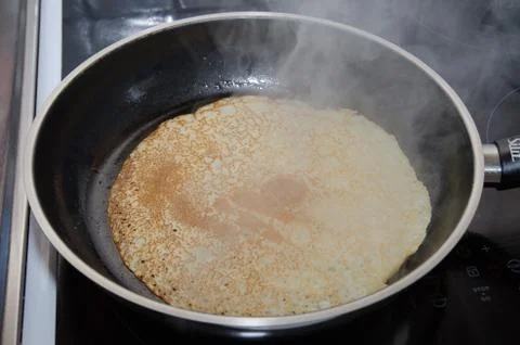 Pancake frying Stock Photos