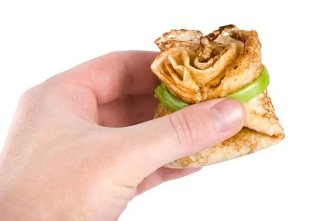 Pancake in hand Stock Photos