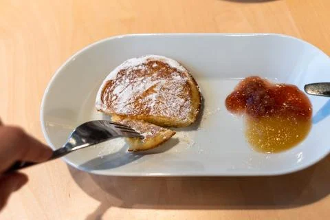 Pancake with jam on a cafeteria plate Fotos de archivo